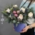 Композиция в шляпной коробке "Снежная королева" из нобилиса, ранункулюса, брунии и эрингиума
