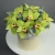 Композиция в шляпной коробке из 11 лаймовых орхидей в Ступино